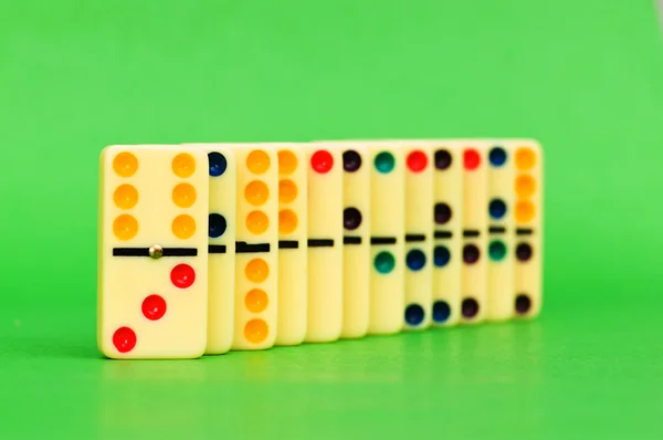 Lots of dominoes on the green — Stock Photo, Image