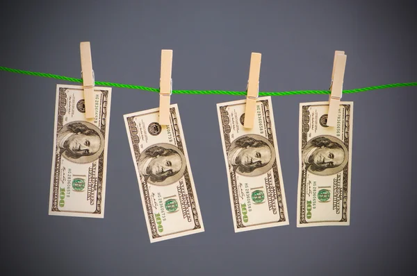 Geldwäsche-Konzept mit Dollars — Stockfoto