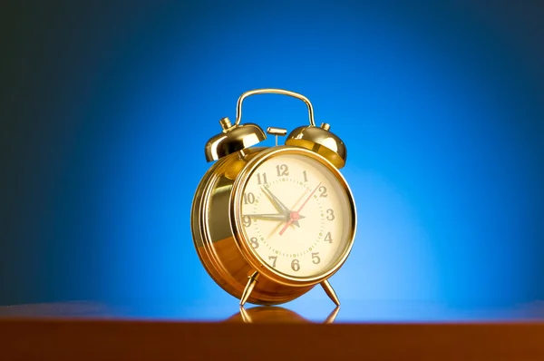 Alarm clock against background — Stock Photo, Image