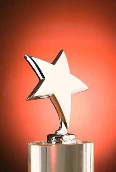 Premio estrella contra el gradiente rojo — Foto de Stock