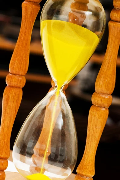 Wooden hourglass isolated on the black — Stock Photo, Image