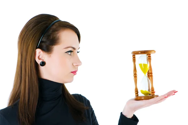 Woman with hourglass isolated — Stock Photo, Image