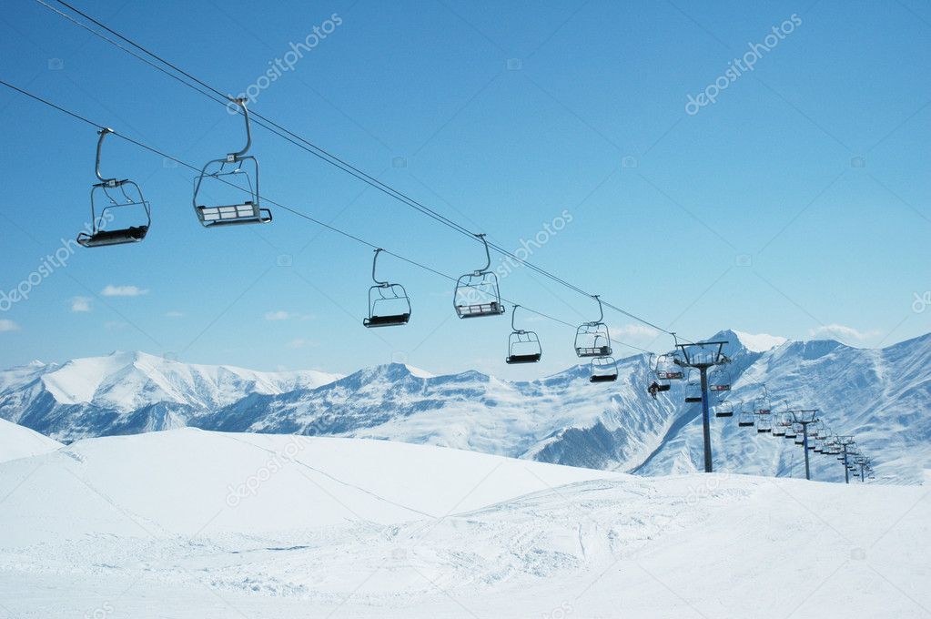 Ski lift chairs on bright day