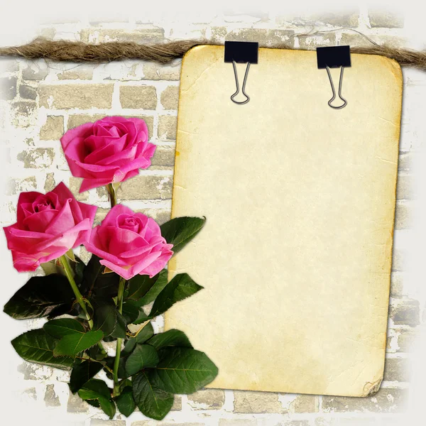 Grunge paper on old rope with roses — Stock Photo, Image