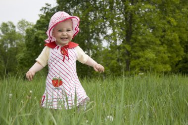 Baby on meadow clipart