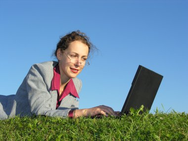 Businesswoman face with notebook on blue sky