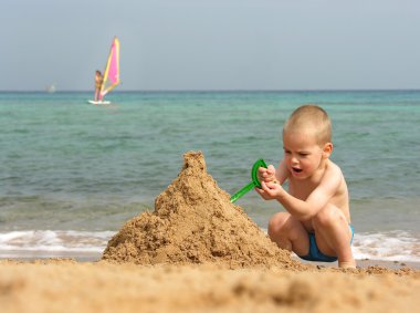 Kid play on beach clipart