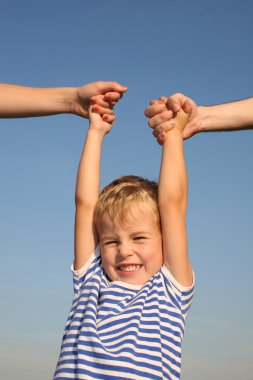 Boy with parents hands clipart