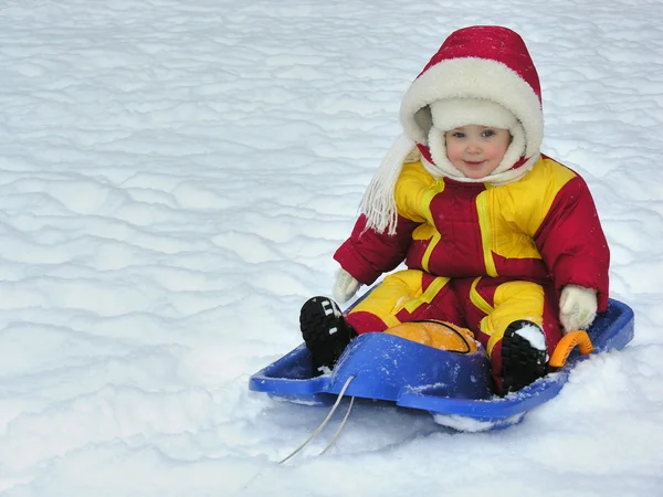 Baby on sled — Stock Photo, Image