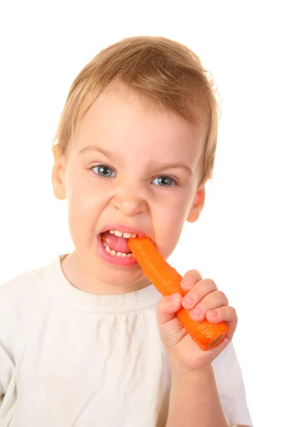 Дитина з морквою — стокове фото
