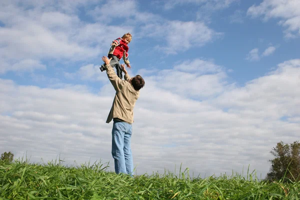 Fly child on father's hands — Stock Photo, Image