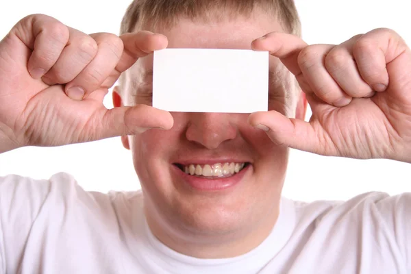 Man with card for text on eyes — Stock Photo, Image