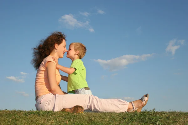 Mother with son on sundown kiss by nose after one year — Stock Photo, Image