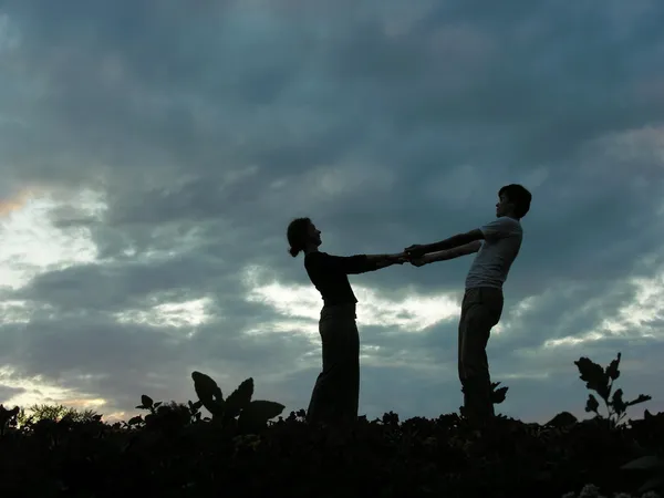 Couple on evening sky — Stock Photo, Image