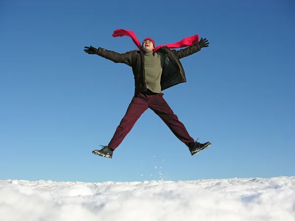 Vliegen sprong gelukkig man. winter. — Stockfoto