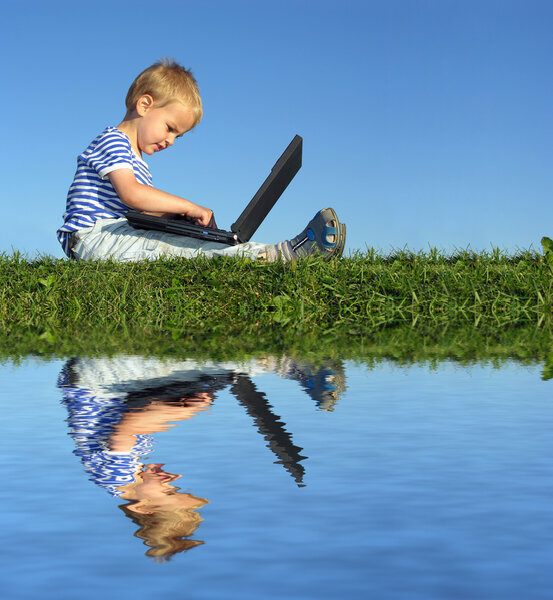 Child with notebook sit blue sky and water
