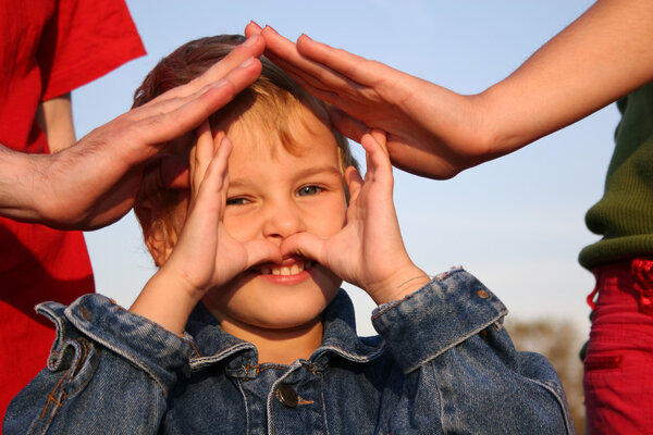 Child and family's hands house