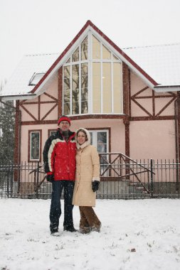 Couple and winter house clipart