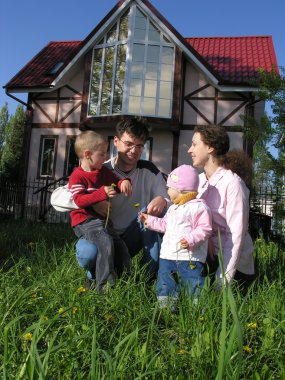 Family of four sit and home clipart