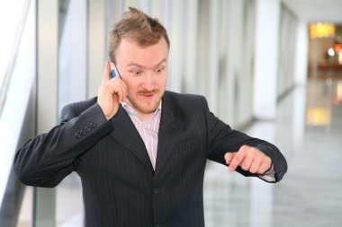 Businessman with phone clipart