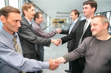 Shaking hands business partners clipart