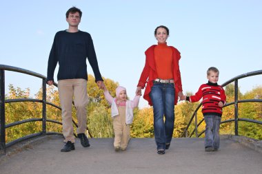 Family of four on bridge clipart