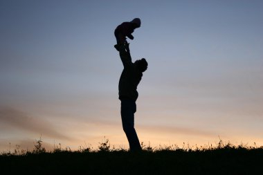 Silhouette father with baby clipart