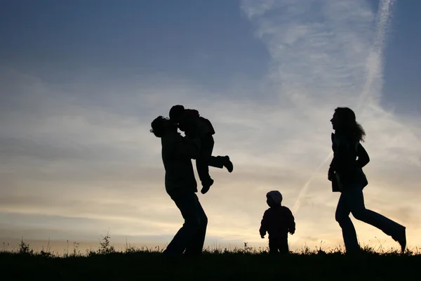 Silhouette family of four — Stock Photo, Image