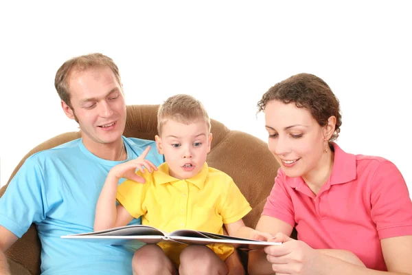 Família com menino ler livro — Fotografia de Stock