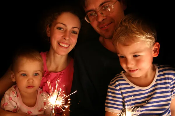 Family with sparkler — Stock Photo, Image