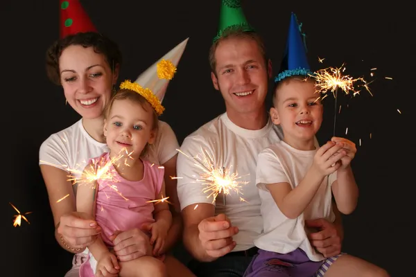 Family of four with sparklers — Stock Photo, Image