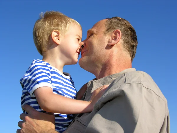 Grandfather with grandson kiss by nose — Stock Photo, Image