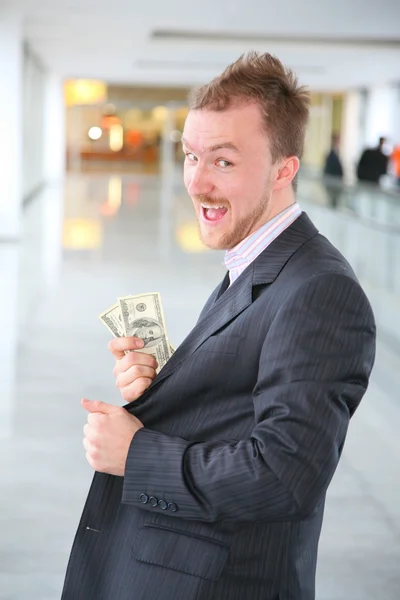 Uomo d'affari felice con dollari — Foto Stock