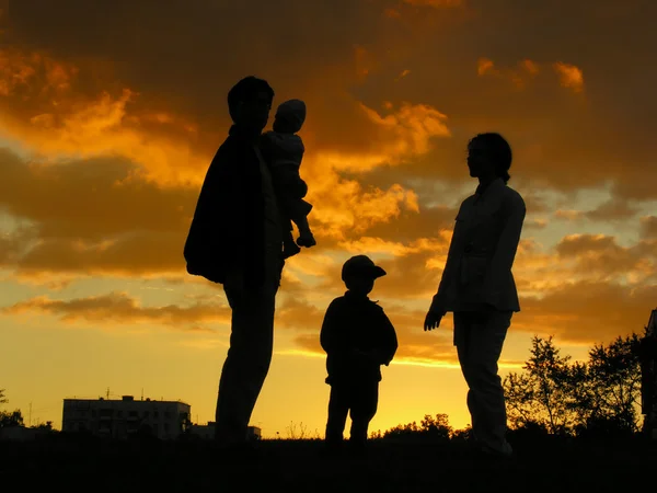 Family of four sunset — Stock Photo, Image