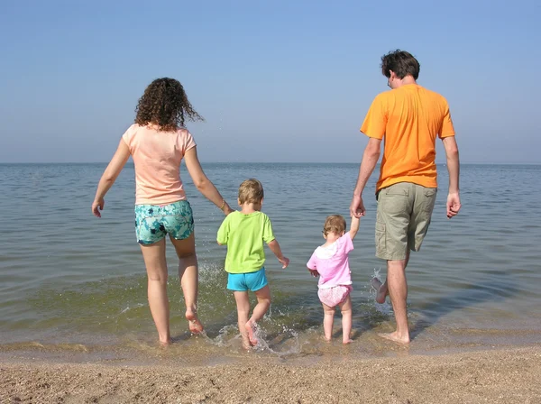 Behind family of four on beach — Stock Photo, Image