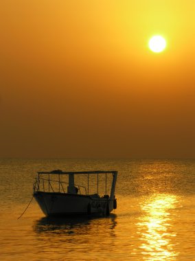 Boat at sunrise clipart