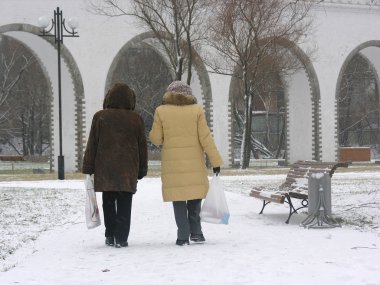 Two woman's back. winter clipart