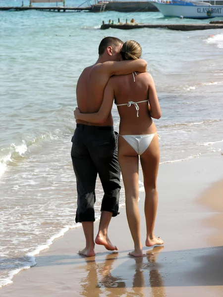 https://static4.depositphotos.com/1000998/364/i/450/depositphotos_3642062-stock-photo-behind-walking-couple-on-beach.jpg