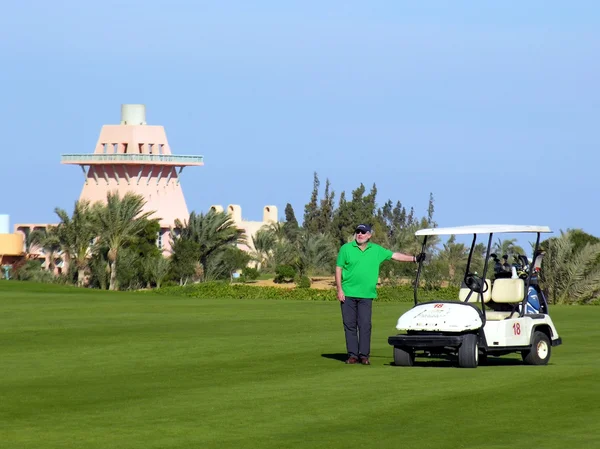 stock image Man with car on golf field