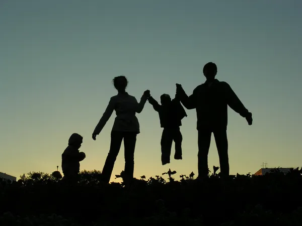 Familie van vier zonsondergang 2 — Stockfoto
