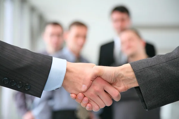 Shaking hands and business team — Stock Photo, Image