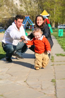 Family with baby in yard 2 clipart