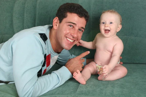 Father with baby on sofa 2 — Stock Photo, Image