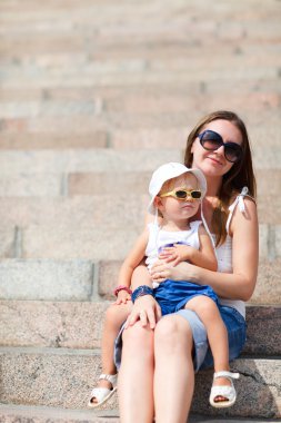 Mother and daughter portrait outdoors clipart