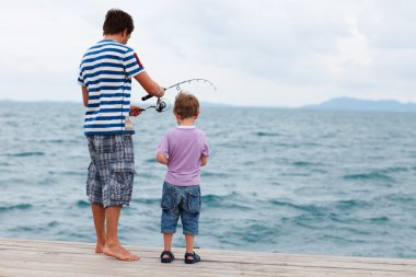 Father and son fishing clipart