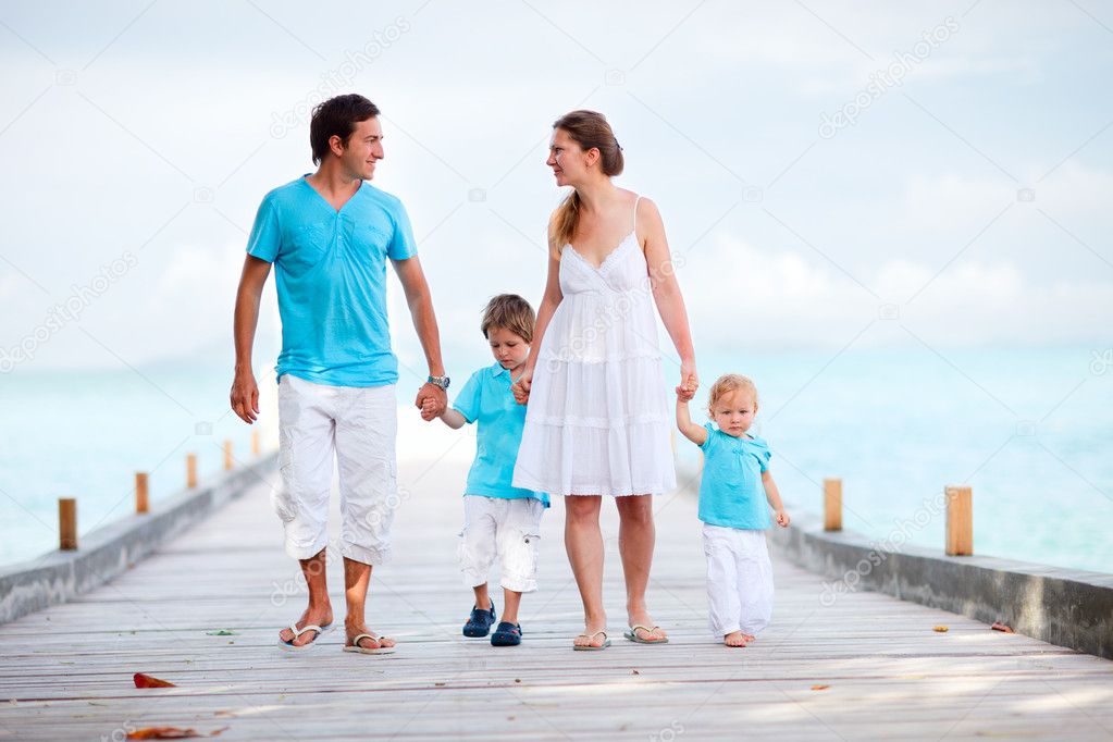 Family walking along jetty
