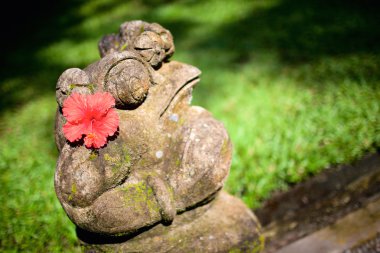 Balinese style frog sculpture clipart