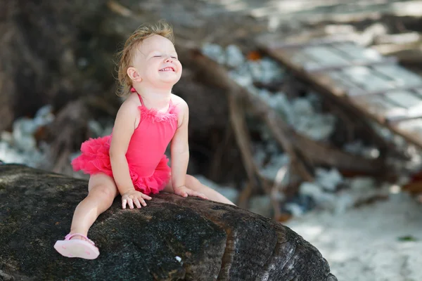 Playful toddler girl in swimsuit — Stockfoto