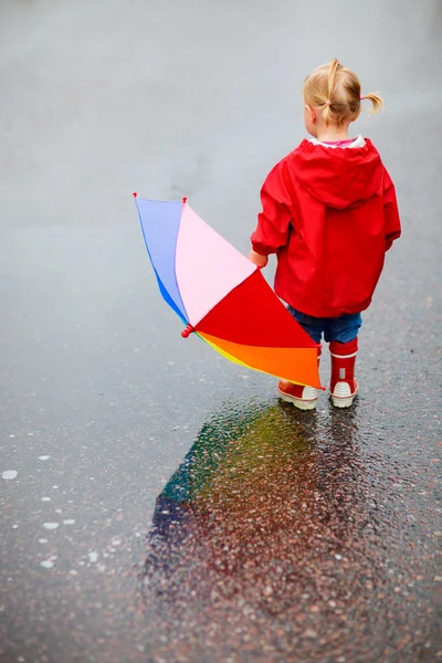 Toddler girl outdoors at rainy day Royalty Free Stock Photos