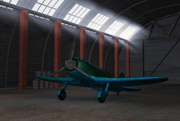 Vechter vliegtuig in hangar Stockfoto